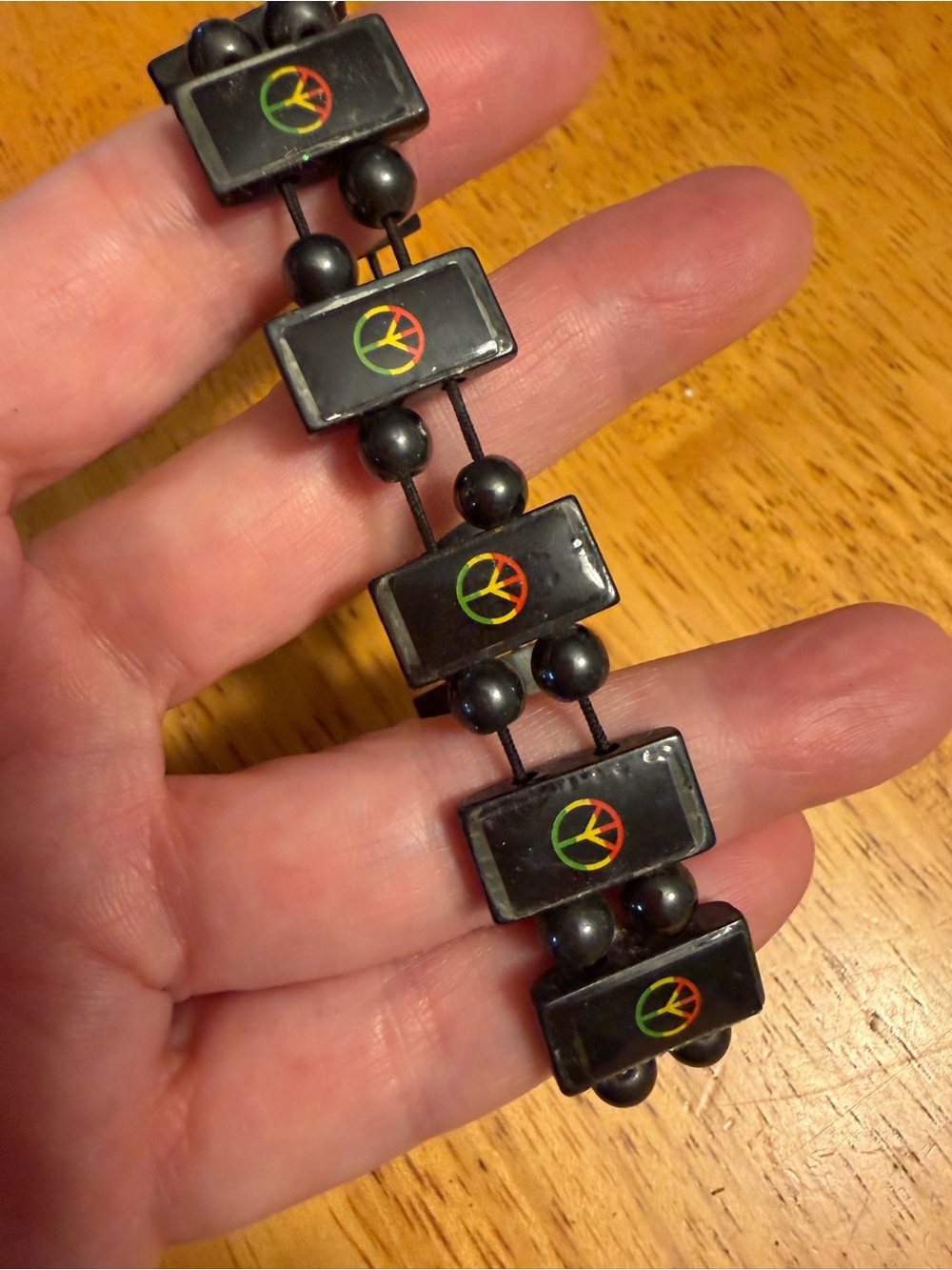 Black Magnetic Elastic Beaded Stretch Bracelet with Rasta Peace Sign Accent